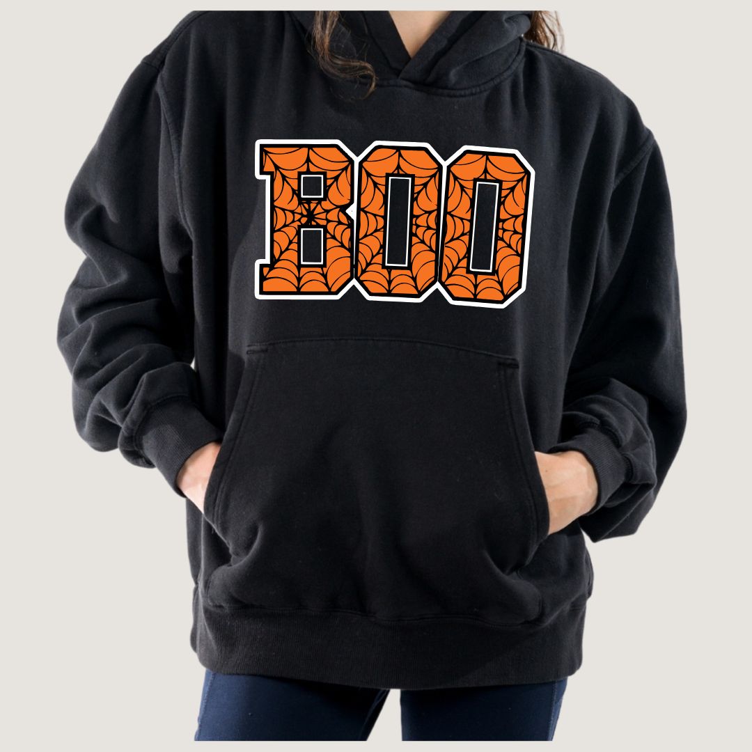 Black hoodie with 'BOO' text in orange and black spider web design on a plain background