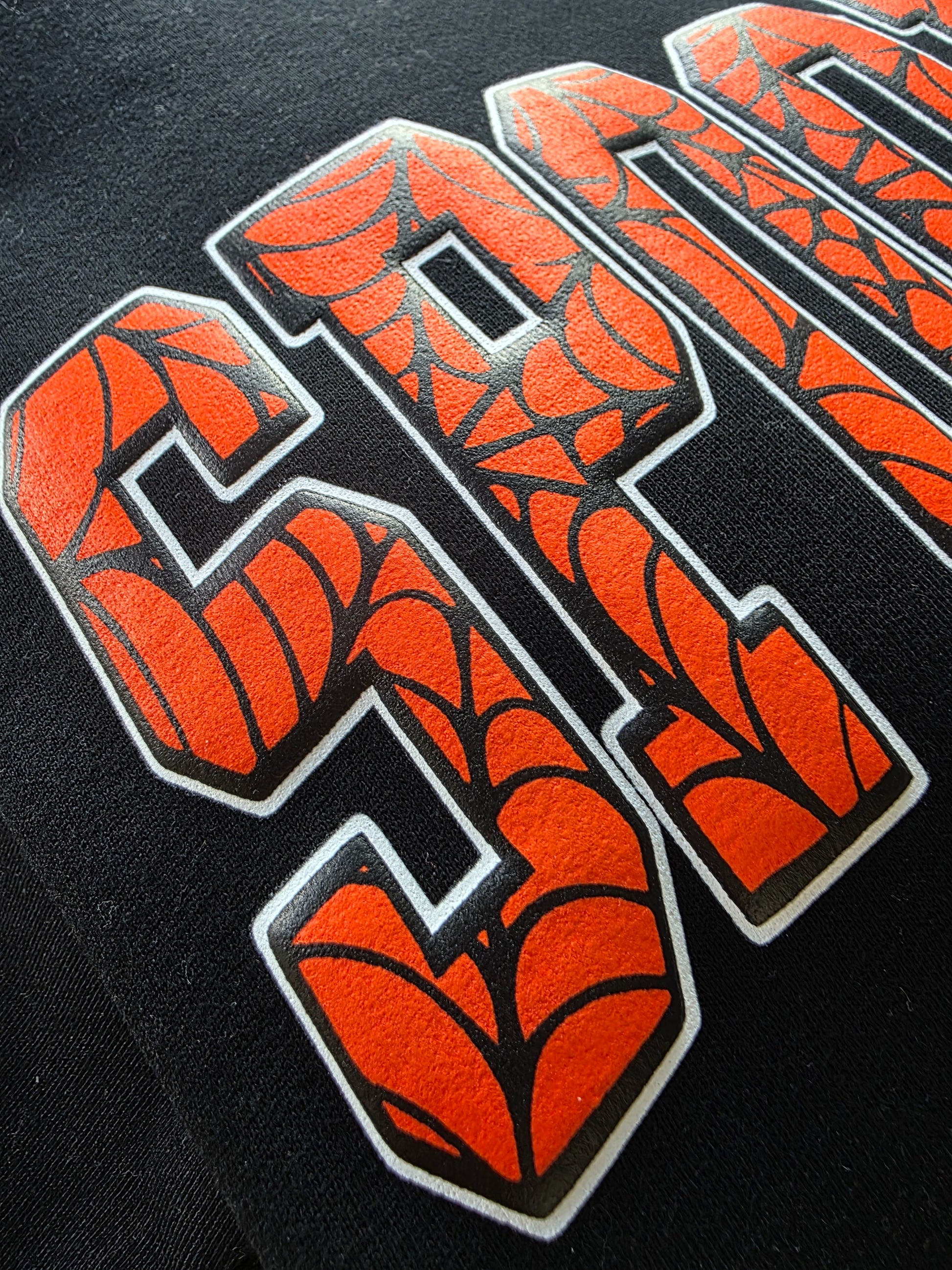 Spider web on Orange Spooky design on a black Hoodie